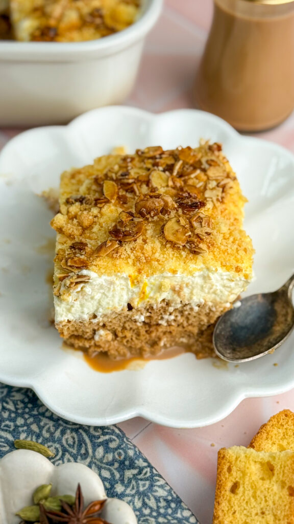 cake soaked in chai, topped with whipped cream and crunchy almonds