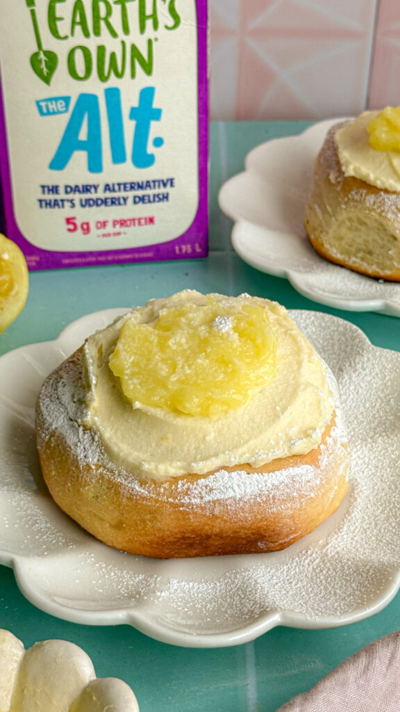 lemon sweet rolls similar to cinnamon rolls topped with cream cheese frosting and lemon curd