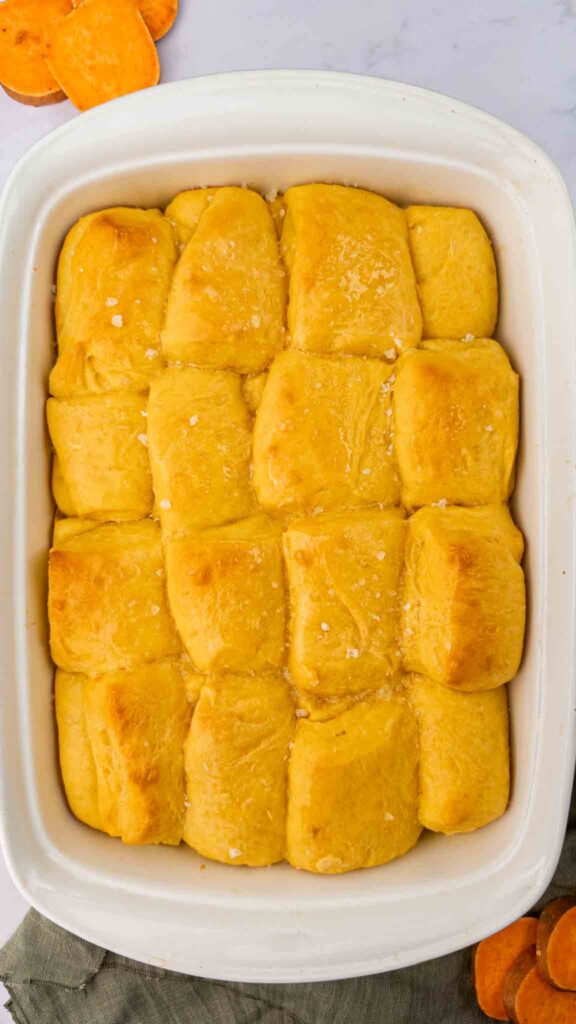9x13 White dish with yellow/orange Parker house rolls made from sweet potato