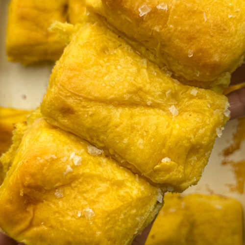 Sweet potato Parker house rolls, three together showcasing the top